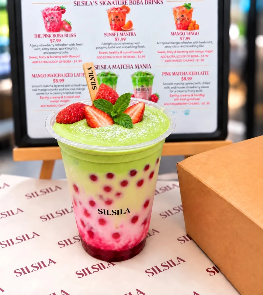 Pink Matcha Iced Latte garnished with fresh strawberries